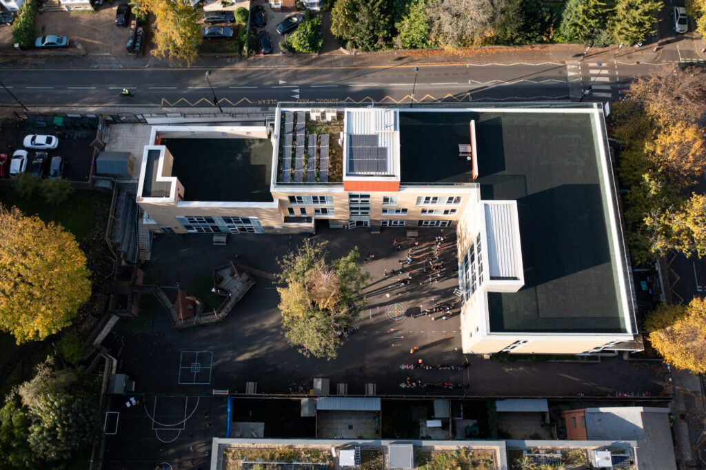 Drone shot of a school with solar panels