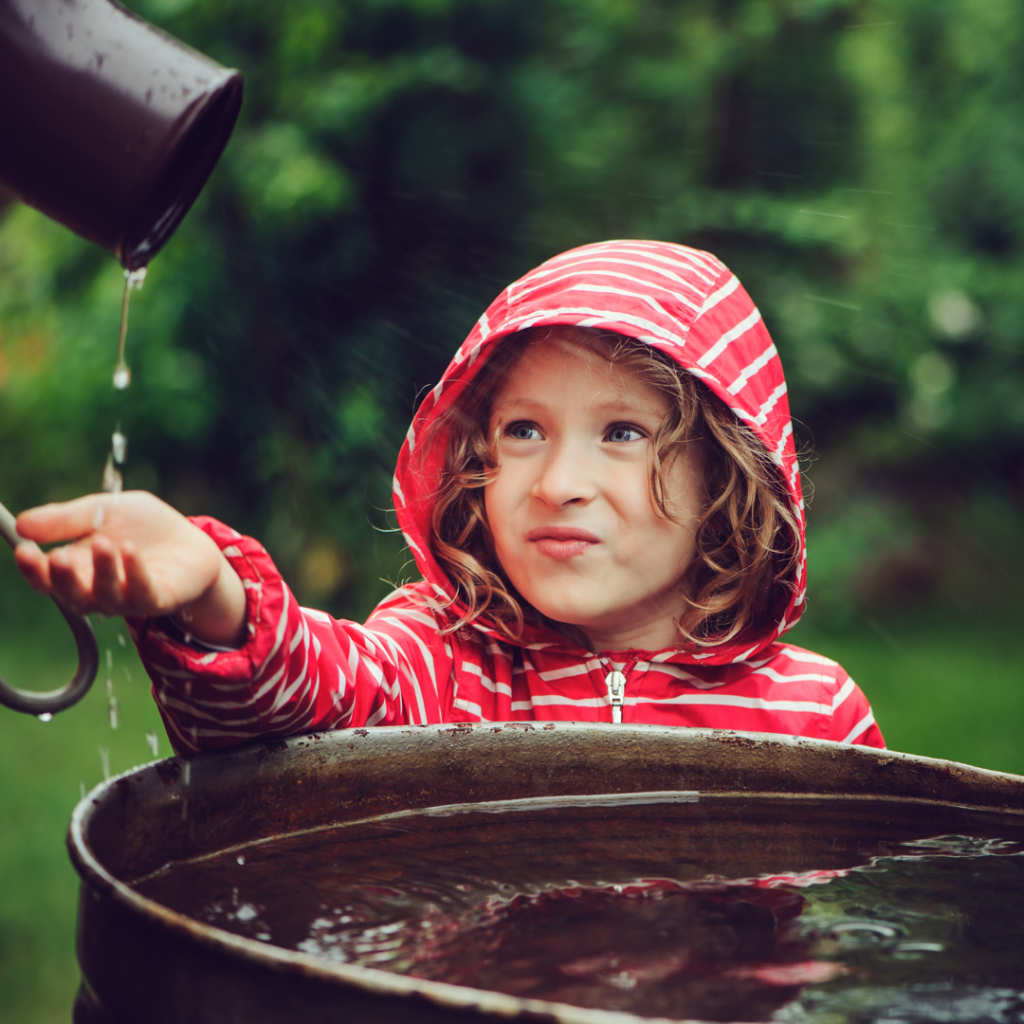 A girl playing with rainwater