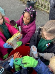 Pupils at Hollinswood school are reducing and re-using plastic – even using old wellies as planters in their school garden.