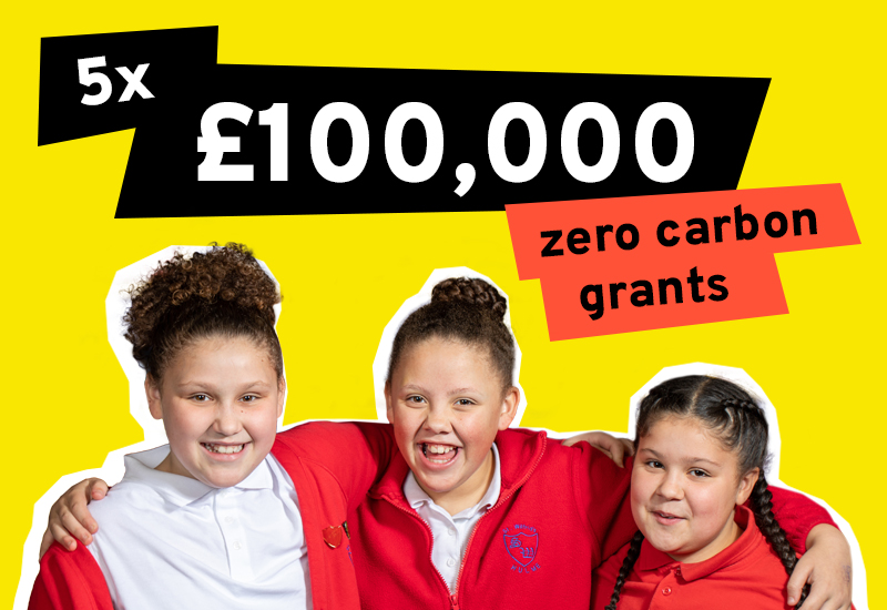 Text reads: 5 x £100,00 zero carbon grants. An image of three school pupils with their arms around each other smiling at the camera accompanies the text.